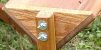 Wing nuts and carriage bolts attach the legs