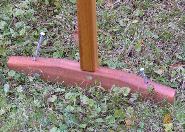 Large cedar feet get spiked to the ground for extra stability